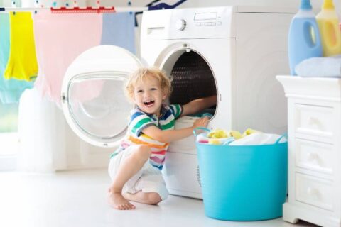 Child in laundry room