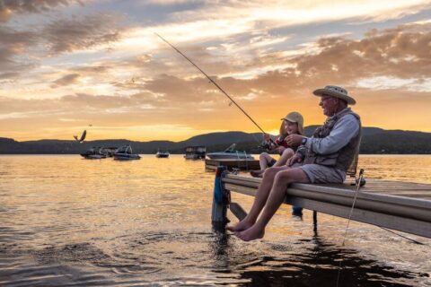 Grandfather and grandson fishing